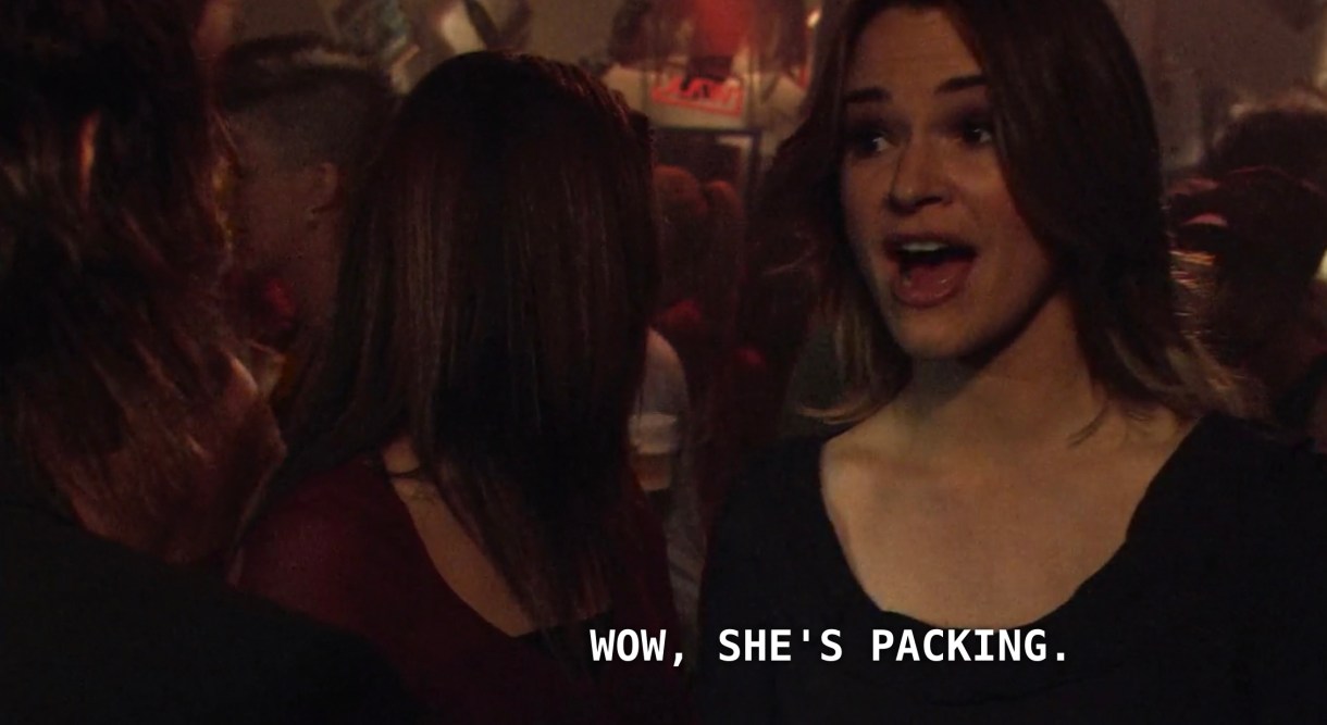 Alice (and her new vampire girlfriend, Uta) are at a crowded dance party at Shane's skate shop. Alice is wearing a u-shaped black top and sees Jenny and Max dancing closely with each other. Alice says, "Wow, she's packing."