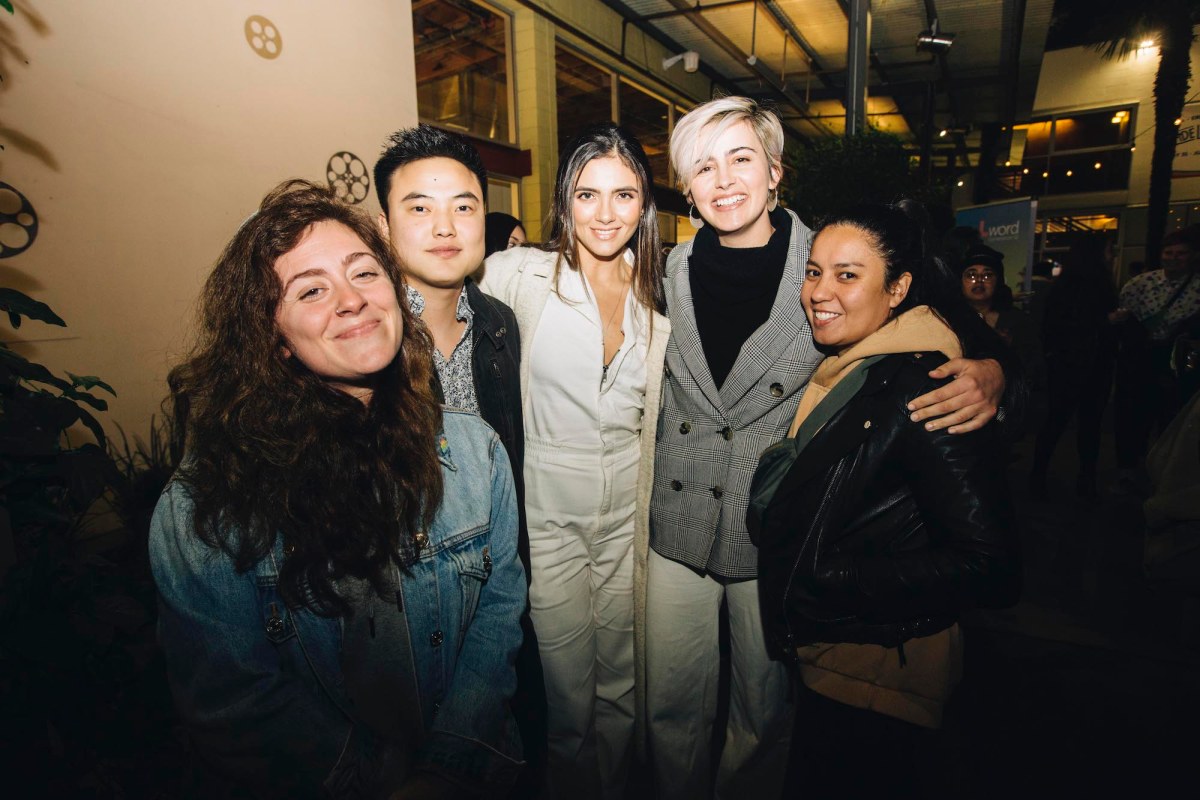 Two guests pose on either side of 3 of the members of Generation Q. From left to right: unnamed guest, Leo Sheng, Arienne Mandi, Jacqueline Toboni, and an unnamed guest.