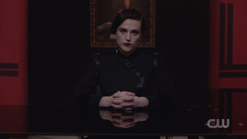 dark lena sits authoritatively