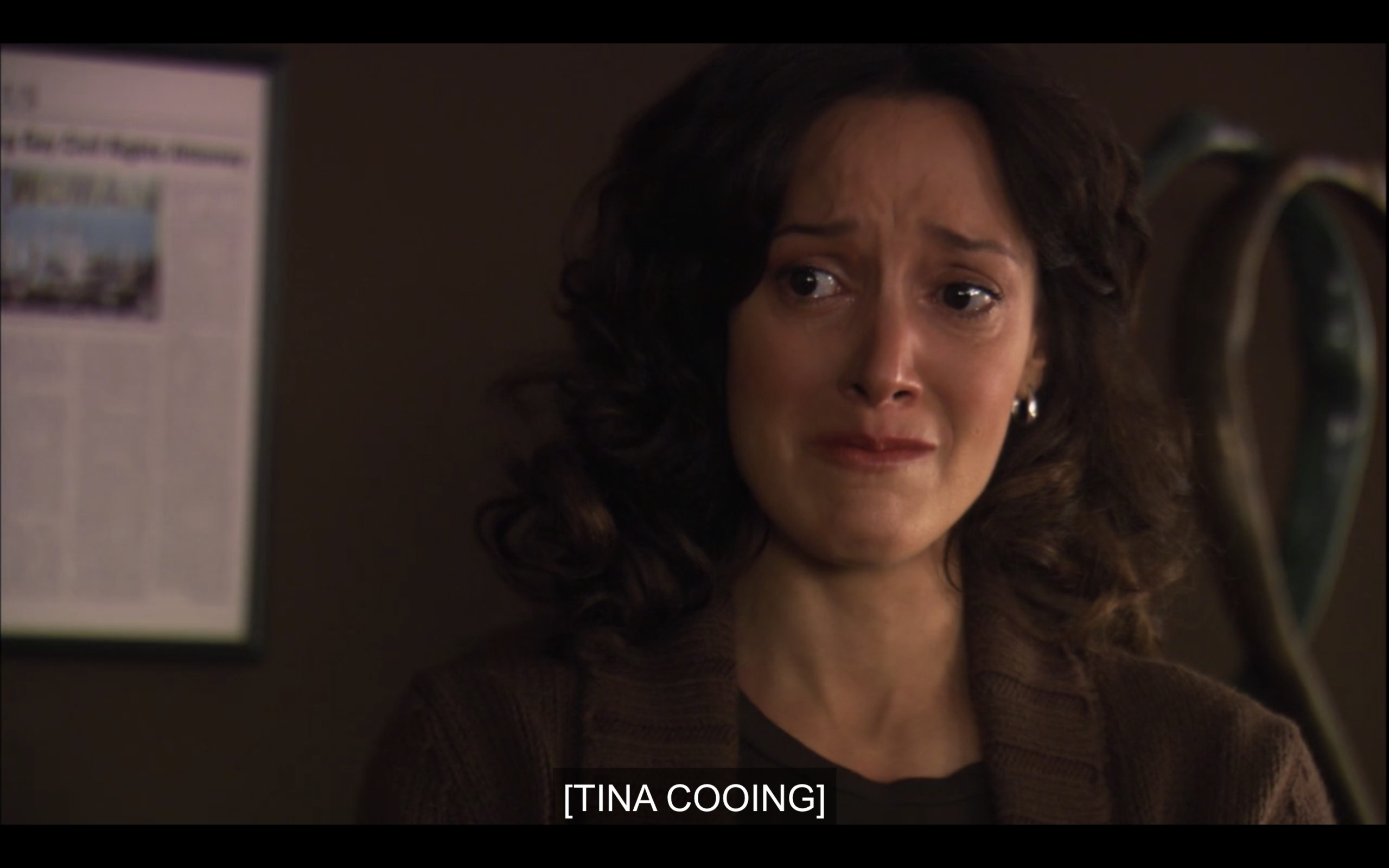 Bette crying in Joyce's office. Caption reads: [Tina Cooing]