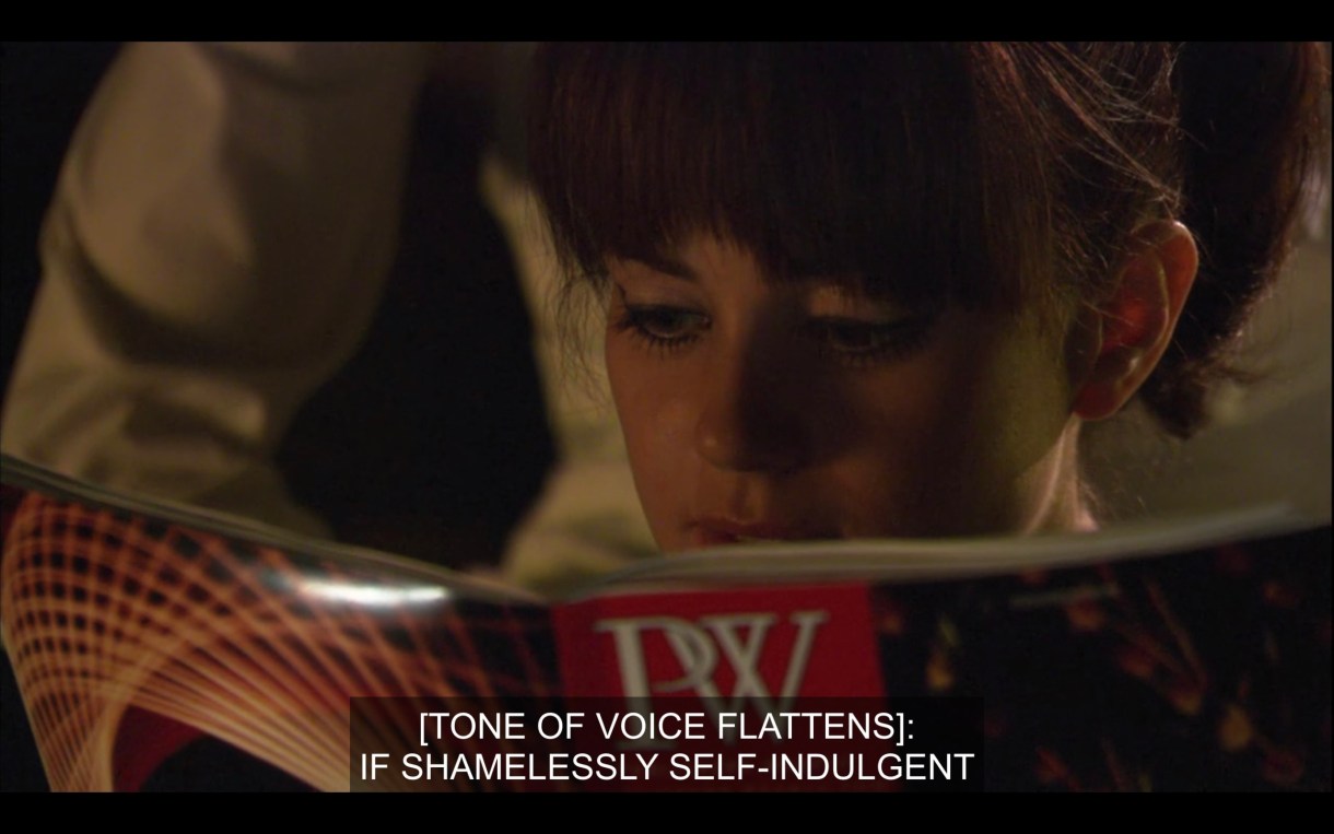 Close up of Jenny reading publisher's weekly. She is reading "if shamelessly self-indulgent"