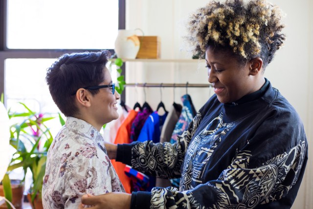 Dante wears a shirt that Doreen picked out for them, and Doreen checks the fit.