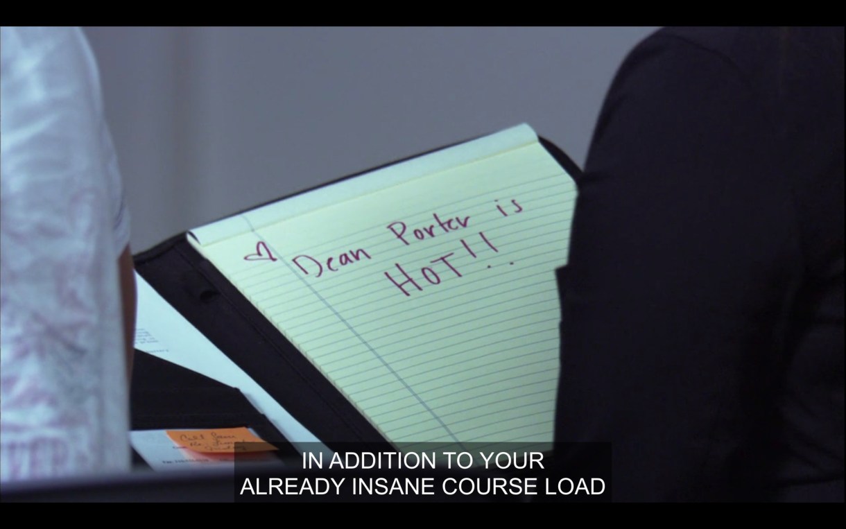 A yellow legal pad with "Dean Porter is HOT!!" written in a purple marker. Of screen, Bette says, "In addition to your already insane course load."