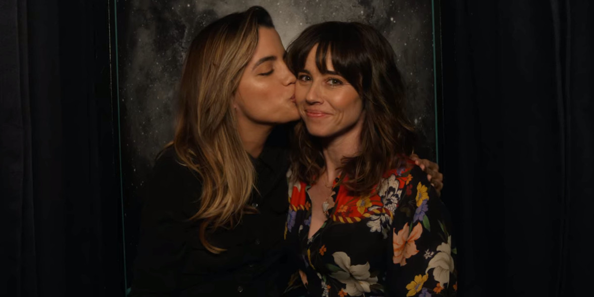 natalie morales kisses linda cardinelli on the cheek