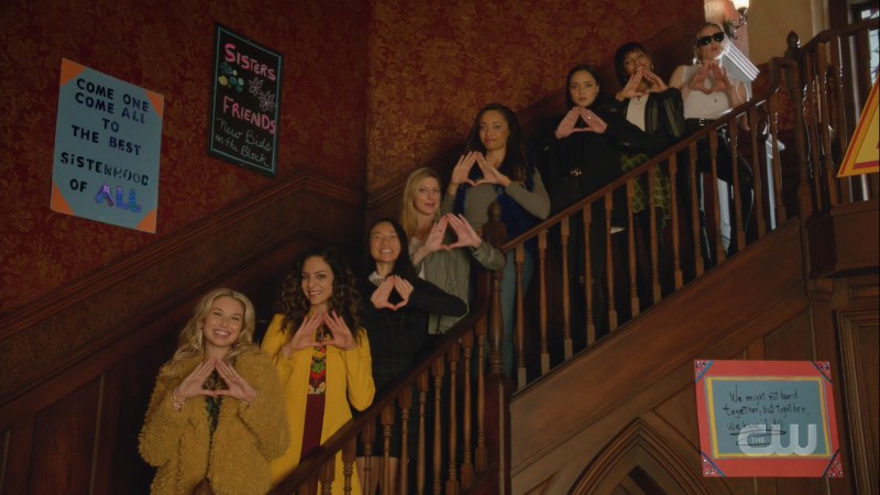 the Deltas make a triangle with their hands