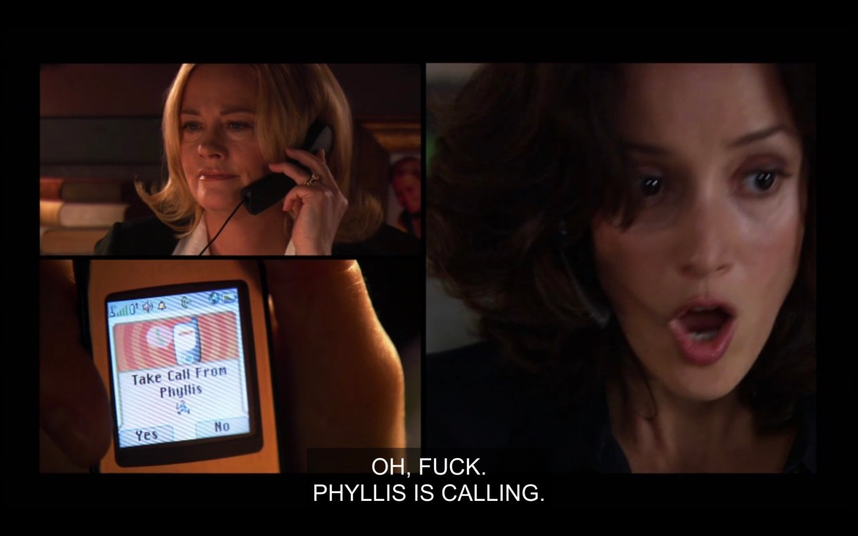 Side by side visual demonstrating that Phyllis is calling Bette. On one side, Phyllis is holding a black landline phone to her ear. Bette has her mouth ajar as she looks at her cell phone, which says, "Take call from Phyllis." Bette says out loud, "Oh, fuck, Phyllis is calling."