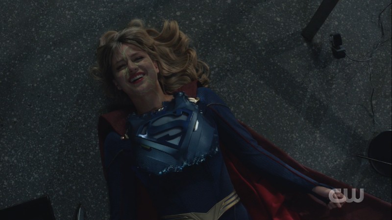 kara smiles as the suit materializes