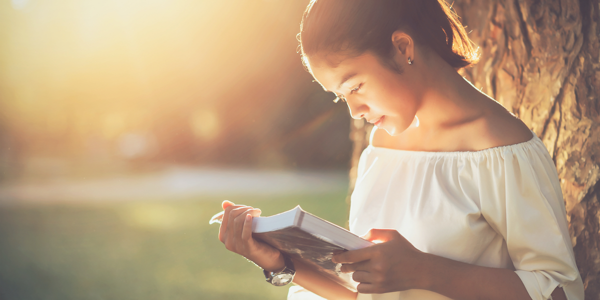 woman reading outside