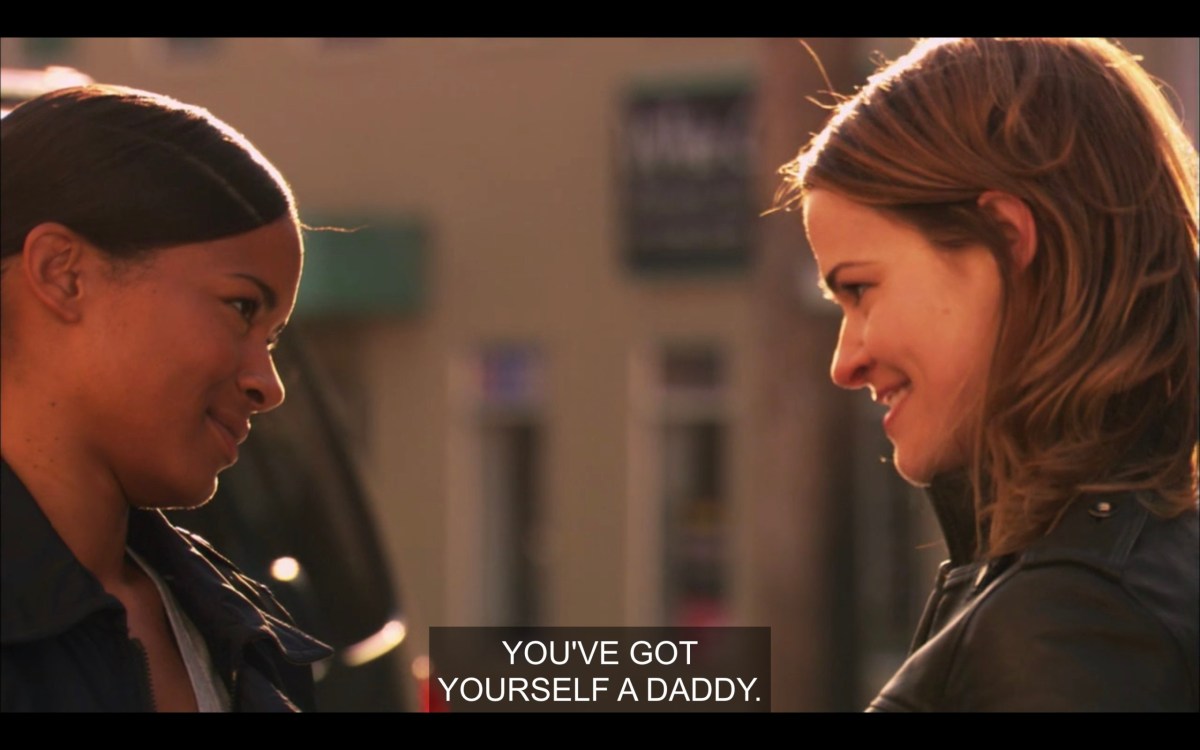 Tasha and Alice stand facing each other and smiling like they're in love. "You've got yourself a daddy."