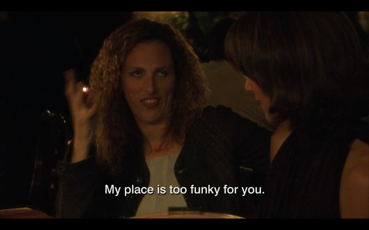 Jodi saying "My place is too funky for you" to Bette in a restaurant