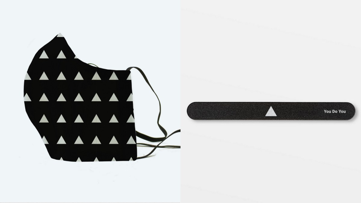 The white Autostraddle triangle finds a home on a black face mask and a nail file.