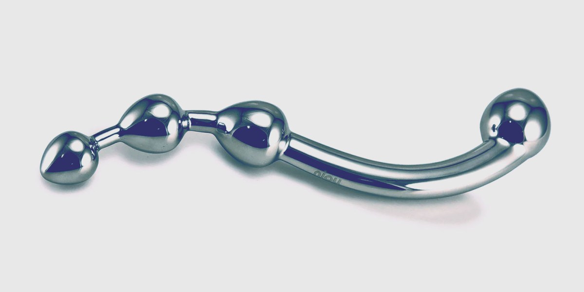 A stainless steel dildo curved in a slight S shape with a large round bulb on one end and three graduated bulbs in a row on the other