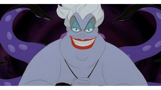 A still of Ursula from the Little Mermaid movie, a fat lavender-skinned merwoman with octopus tentacles, bright red lipstick, and white hair