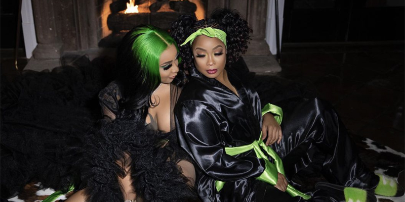 Da Brat celebrates the holidays in front of the fire with her partner.