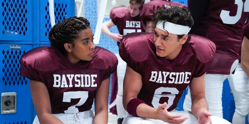 Aisha (Alycia Pascual-Pena) in her football jersey in the Bayside High locker room.