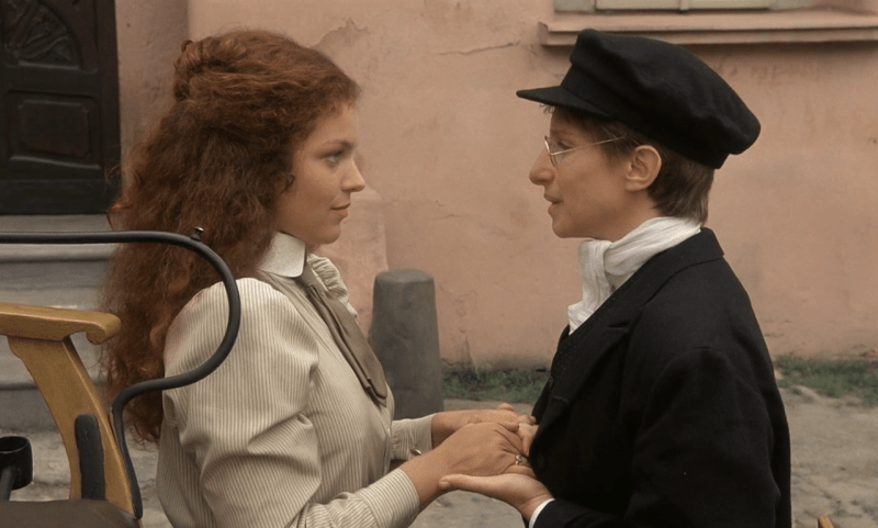 Amy Irving holds Barbra Streisand's hands in Yentl