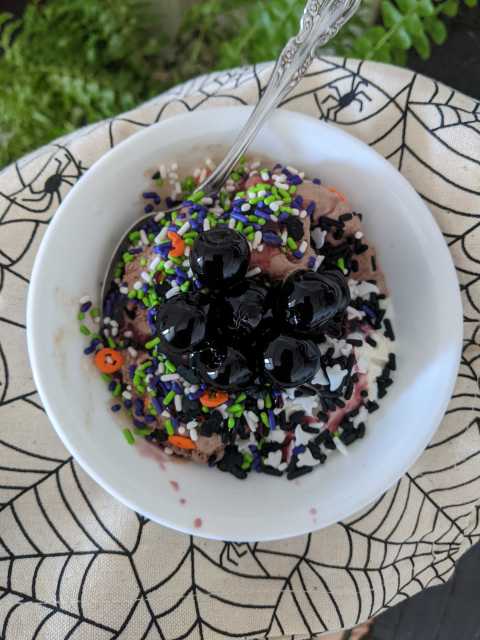 an ice cream sundae with halloween sprinkles