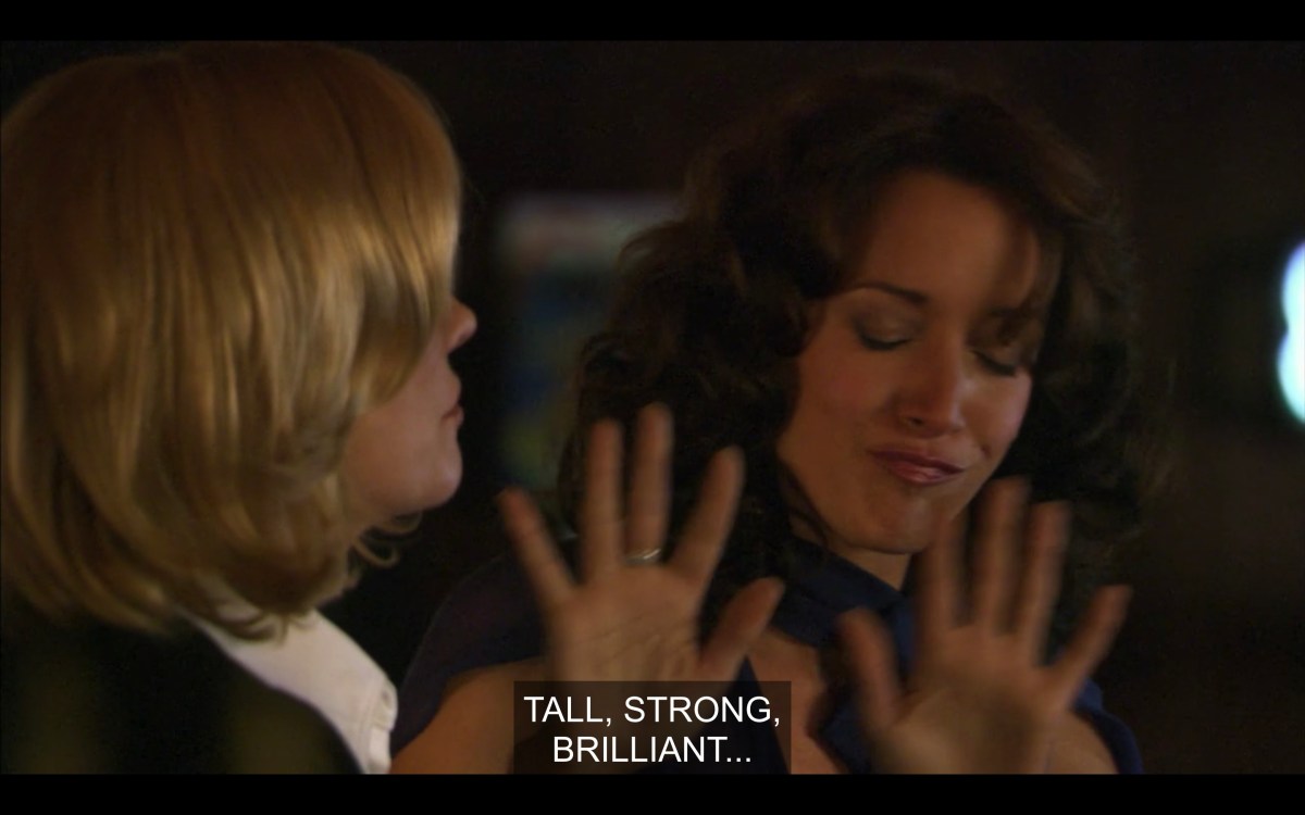 Phyllis says "tall, strong, brilliant?" while Bette is like, "please no" with her hands