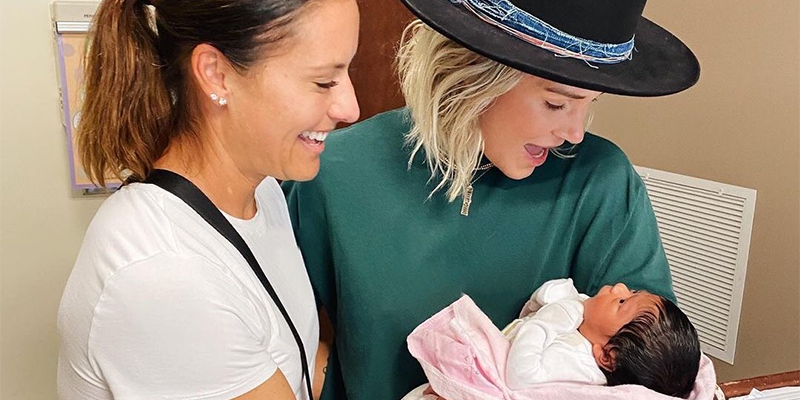 Ashlyn Harris, Ali Krieger, and their daughter.