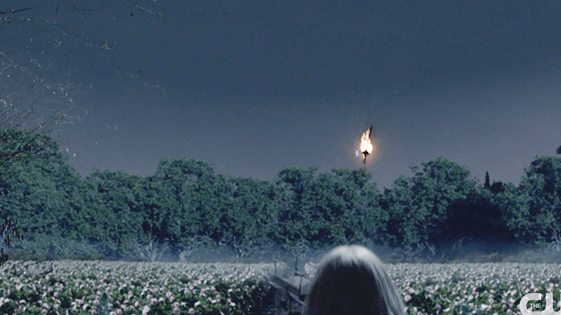 Flaming torch over field