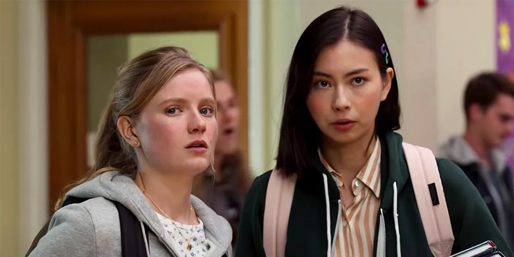 Moxie Review: Hadley Robinson and Lauren Tsai stand together in the hallway of their school.