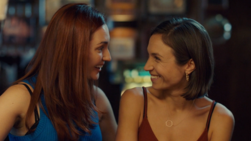 Nicole Haught and Waverly Earp exchange loving looks.