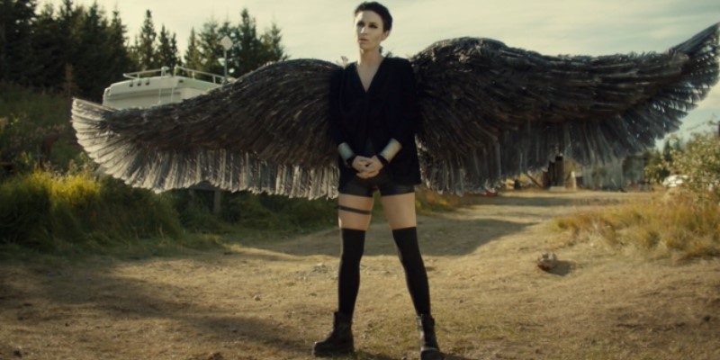 Dark Angel Waverly stands proud, wings spread.