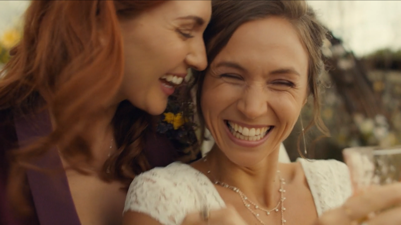 Waverly and Nicole laugh and are visibly in love.