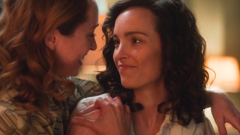 For All Mankind lesbians Ellen looks lovingly at Pam, who has a hand on her shoulder and is returning her smile