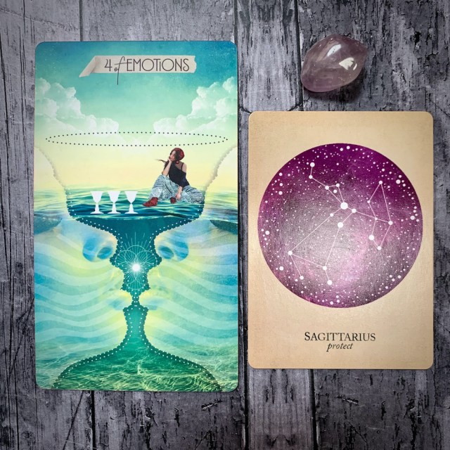 A tarot card for the 4 of Emotions, featuring a figure inside a giant goblet seemingly cast of water as they consider three other, smaller goblets, and two faces in profile seem about to kiss in the background. A constellation card reads Sagittarius: Protect, with a translucent lavender crystal.