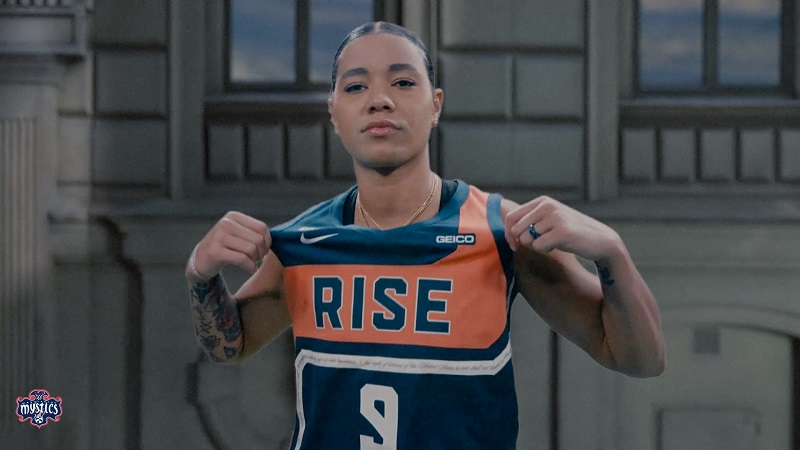 Mystics Guard Natasha Cloud shows off Washington's new Rebel Edition jersey.