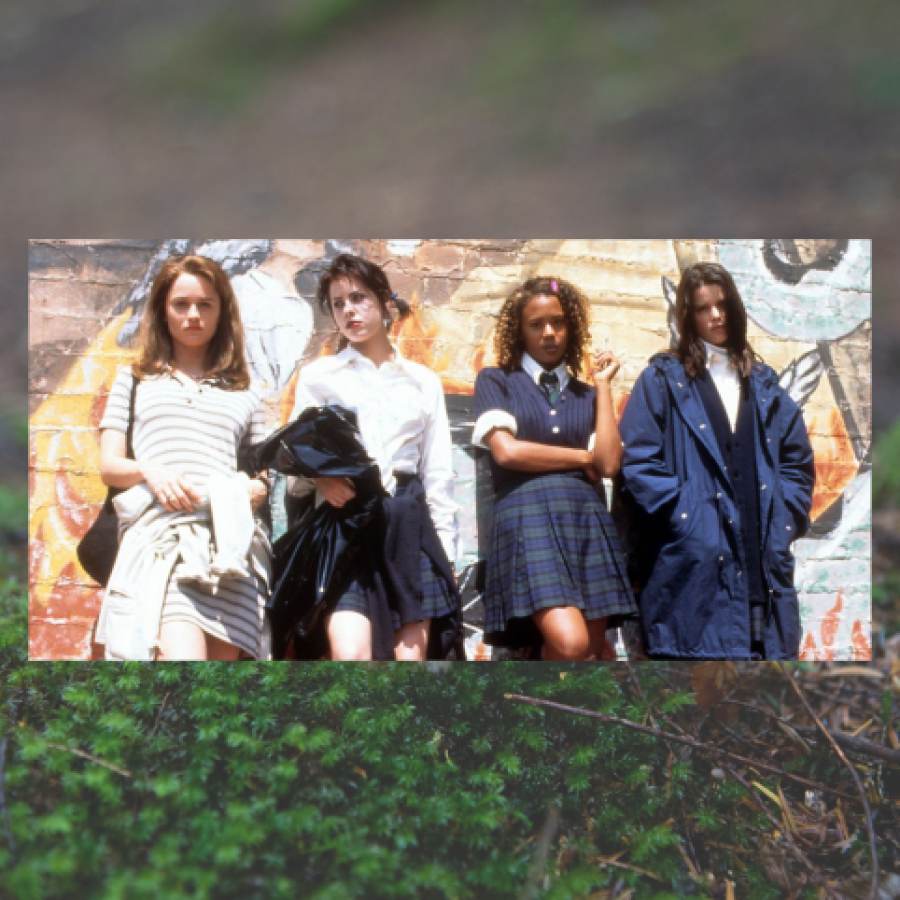 The Craft 25th Anniversary: Image shows 4 girls in catholic school girl uniforms but wearing them in different ways. A transparent image behind it shows grass in a field.