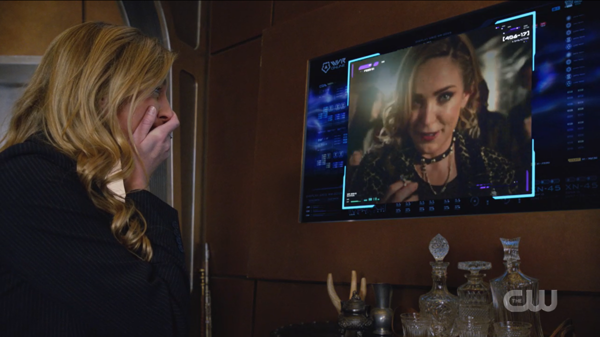 Legends of Tomorrow recap: Ava covers her face in joy as she watches the footage of Sara talking about proposing.