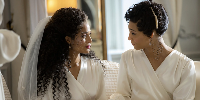 MJ Rodriguez and Indya Moore in white wedding day outfits