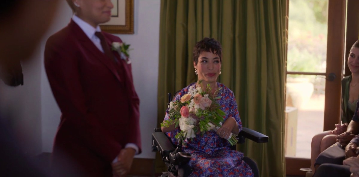 Maribel with flowers in the wedding room