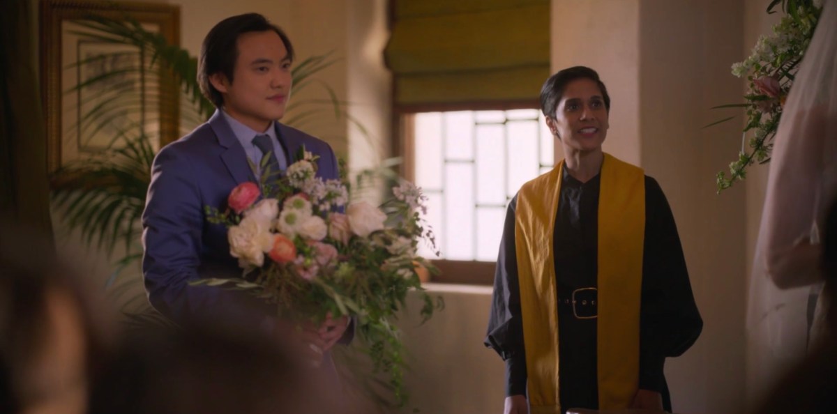 Micah with flowers at the wedding