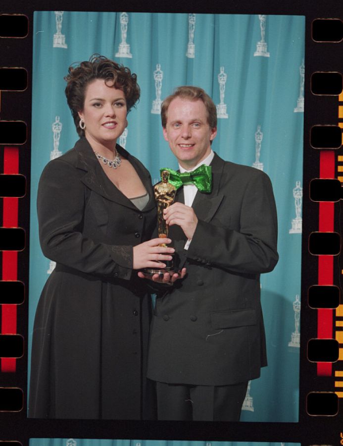 Nick Park Holding His Oscar with Presenter Rosie O'Donnell 
