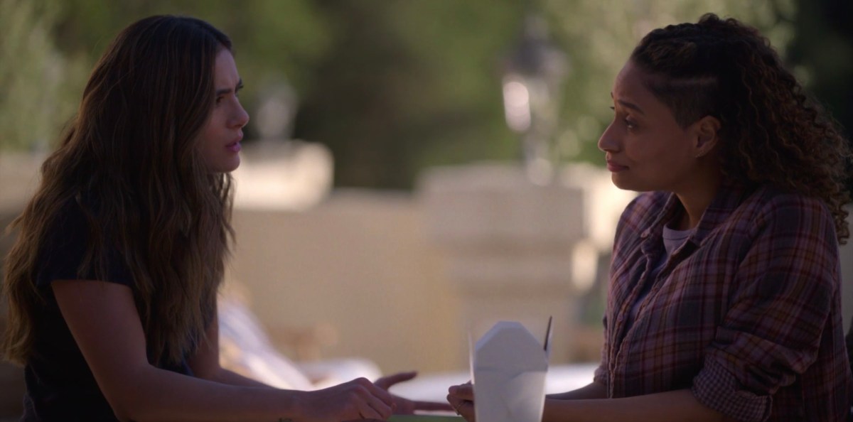 Sophie and Dani sitting outside with takeout