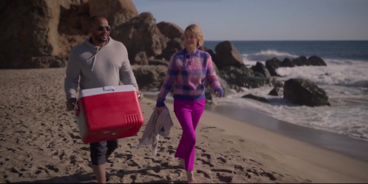 Tom and Alice walking on the beach