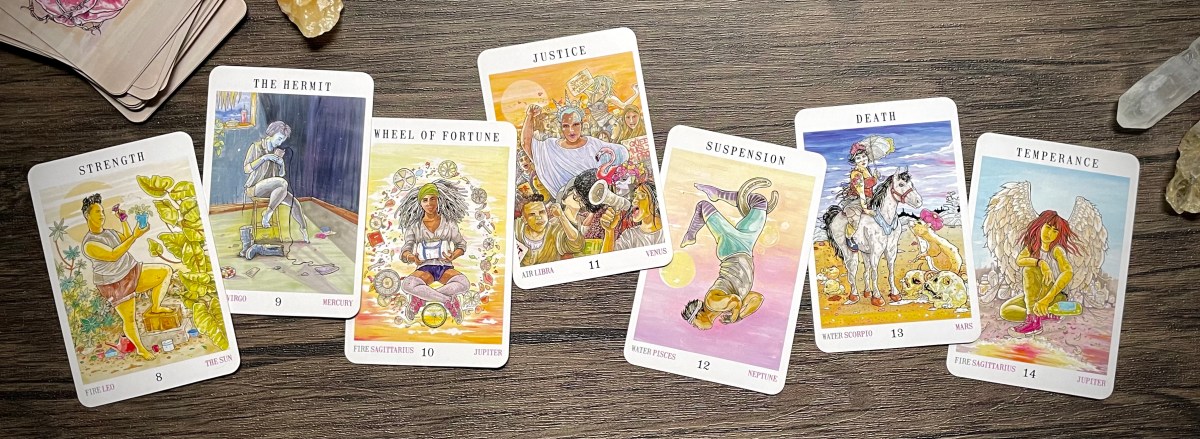 The middle line of the major arcana, seven cards laid out in a line with crystals