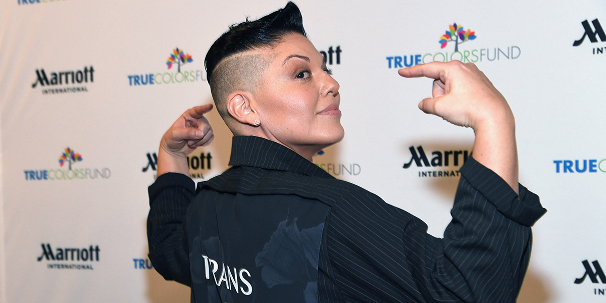 Sara Ramirez Lex profile went u today, here they are on the red carpet in a black coat that says