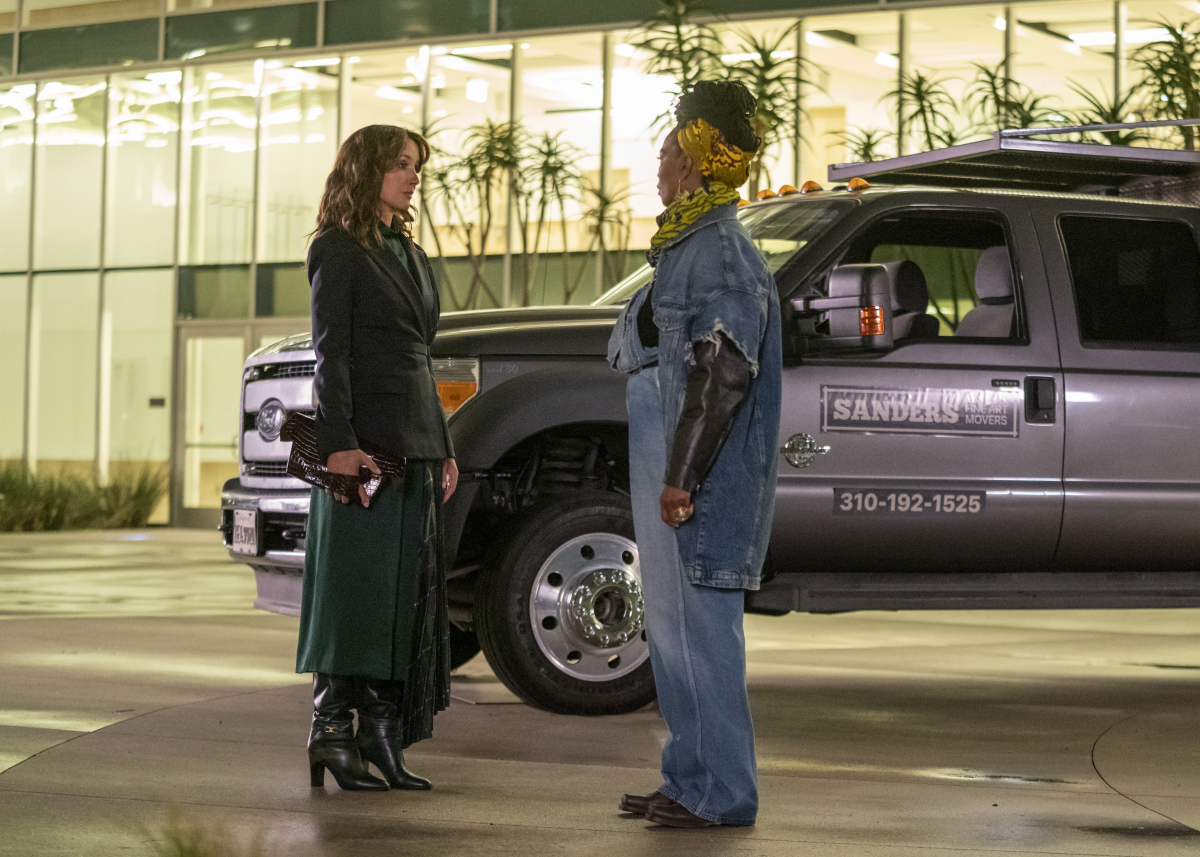 208 - Launch Party bette and pippa standing outside a gallery in front of an SUV