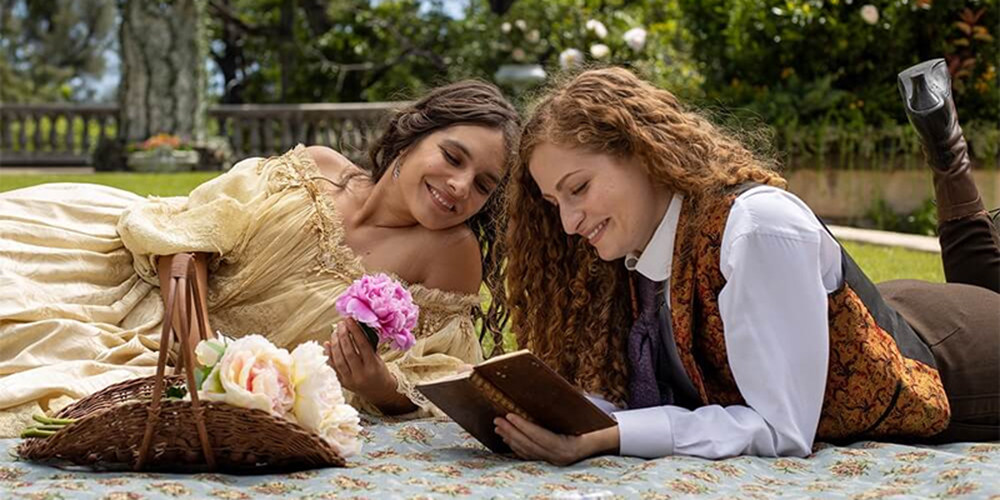 Rachel and Isabel read together on the lawn