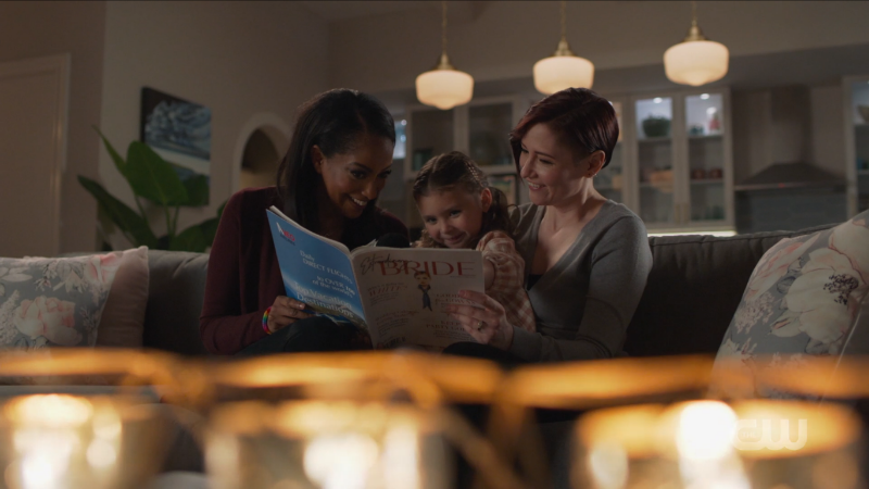 Alex, Kelly, and Esme read bridal magazines together