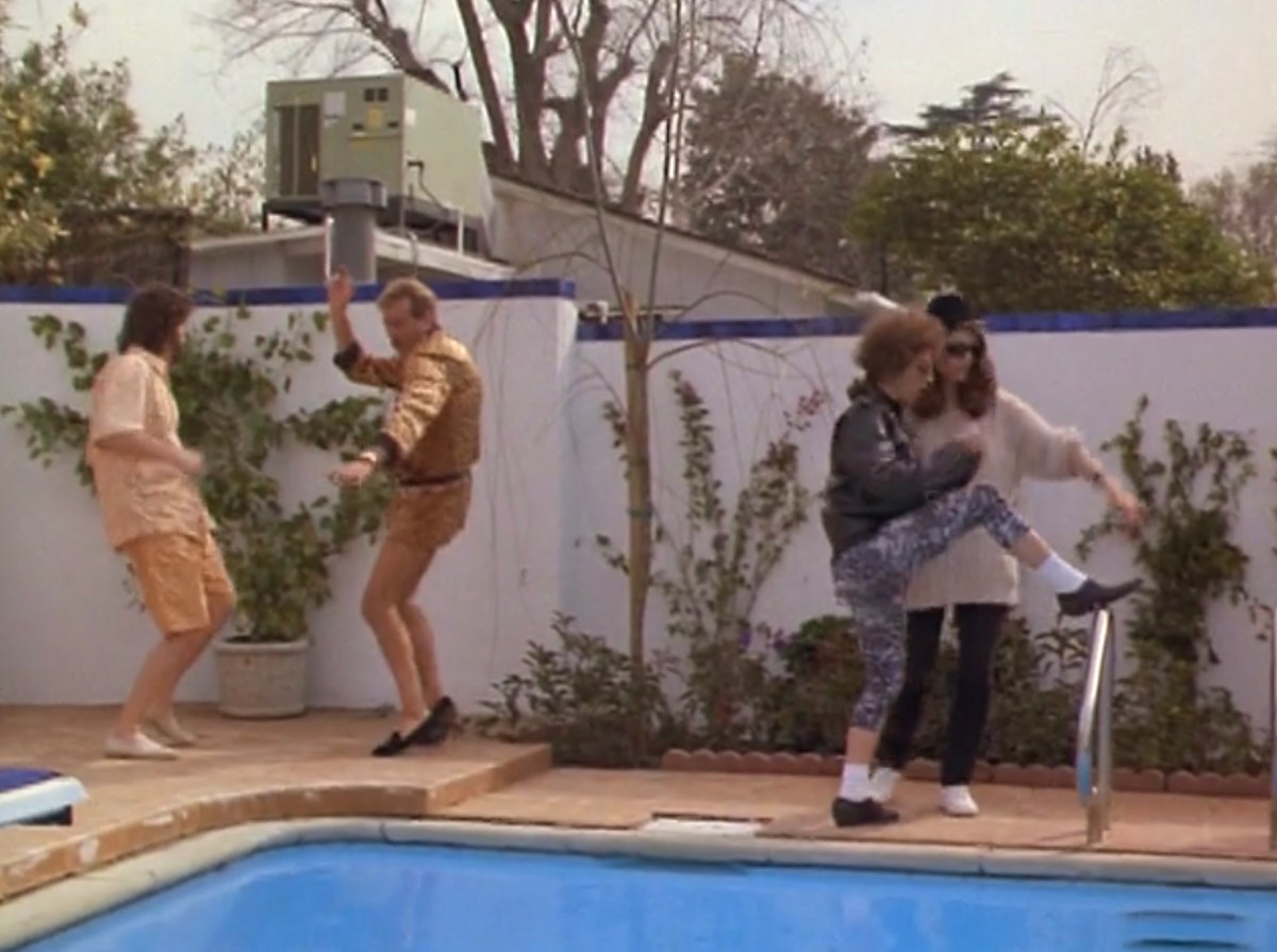 everyone dancing by the pool