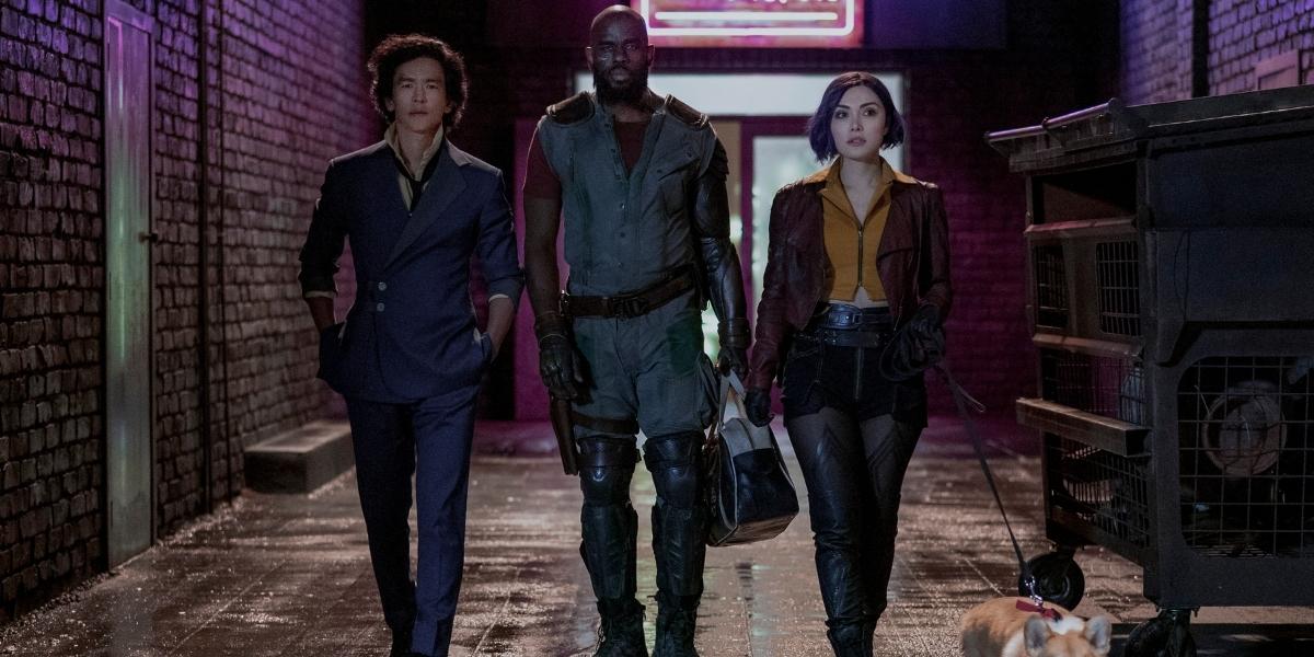 COWBOY BEBOP (L to R) JOHN CHO as SPIKE SPIEGEL, MUSTAFA SHAKIR as JET BLACK, DANIELLA PINEDA as FAYE VALENTINE and EIN in Cowboy Bebop Cr. GEOFFREY SHORT/NETFLIX © 2021