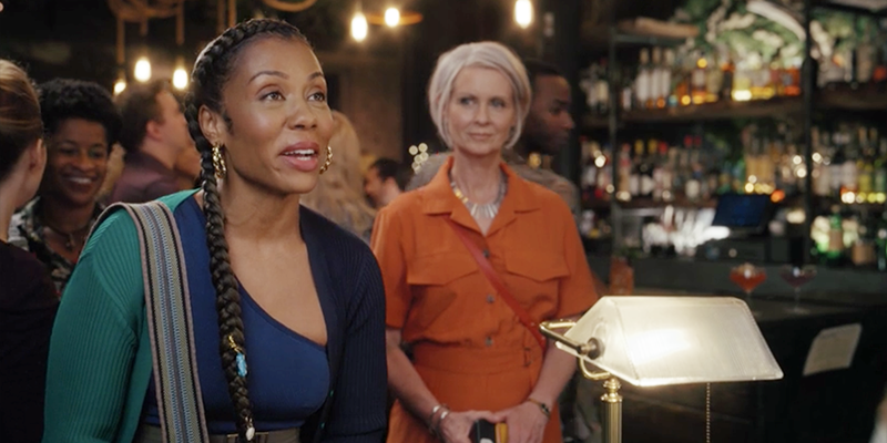 Miranda and Dr. Nya Wallace wait for their table on their dinner date