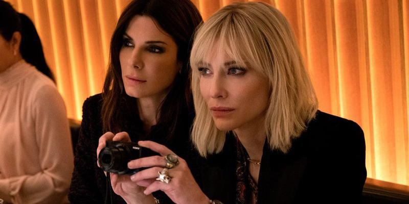 Cate Blanchett and Sandra Bullock in Ocean's 8 looking shifty