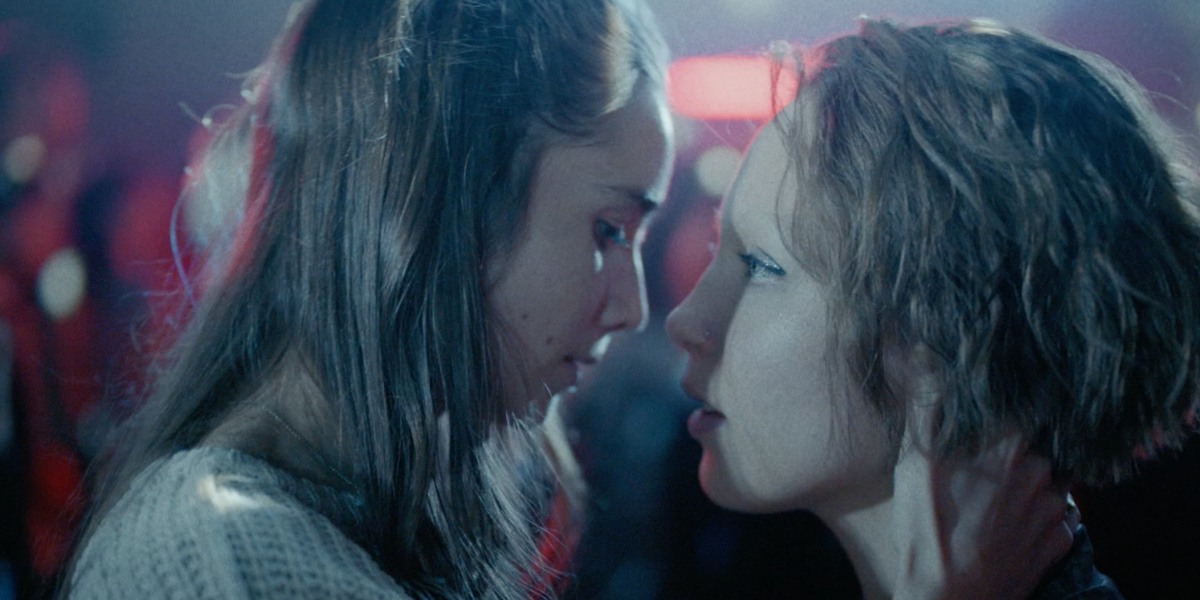 A close up of Aamu Milonoff and Linnea Leino staring at each other on the dance floor.