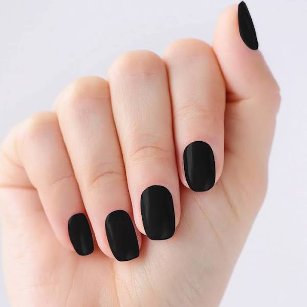 A white hand showcases OPI's Black Nail Polish